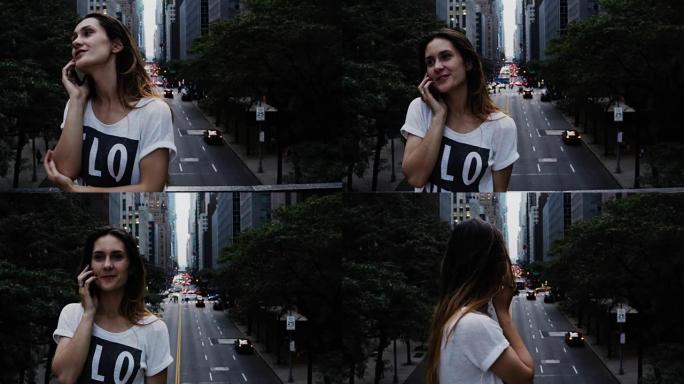 年轻漂亮的女人站在美国纽约市中心的桥上，用手机、智能手机聊天