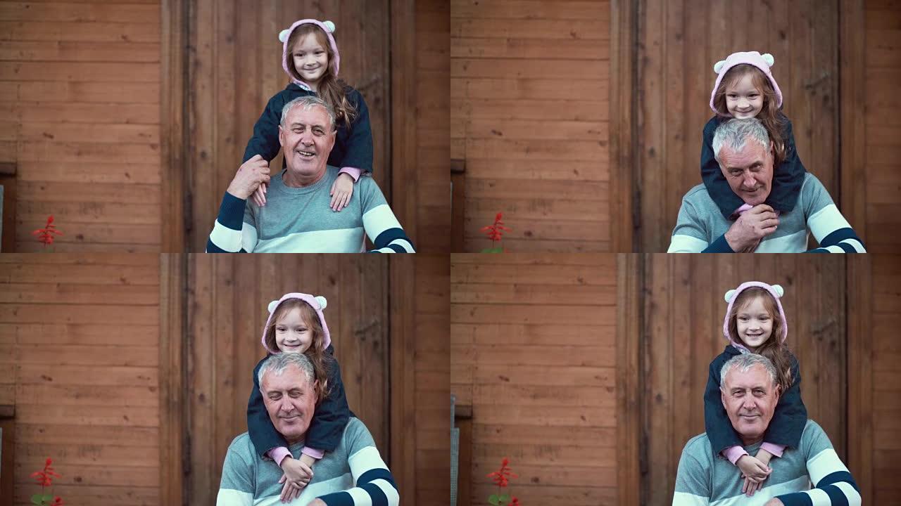 孙女站在祖父身后，拥抱老人微笑。女孩乐队和男性亲吻她的手。4K