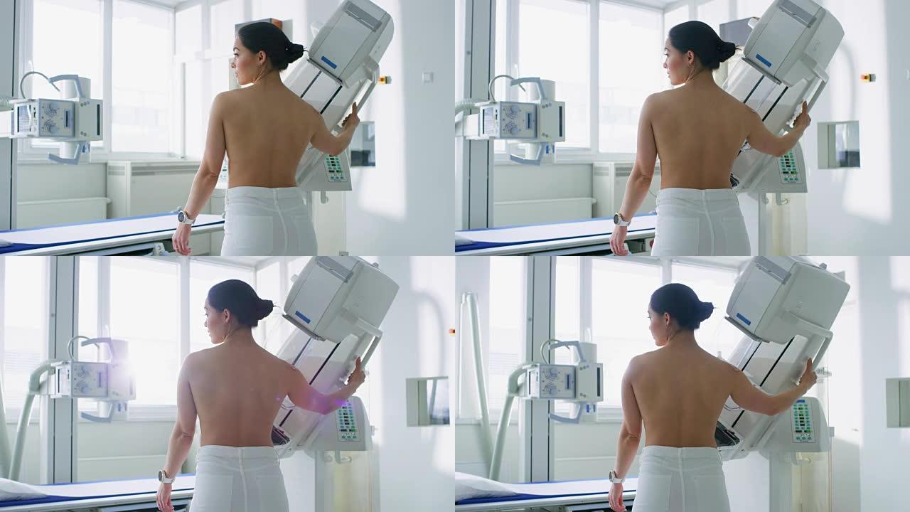 在医院里，裸露上身的女性病人正在接受乳房x光检查。健康年轻女性进行癌症预防性乳房x线摄影扫描。拥有高