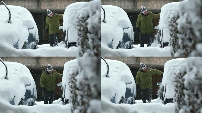 高清: 男子清洁埋在深雪中的汽车