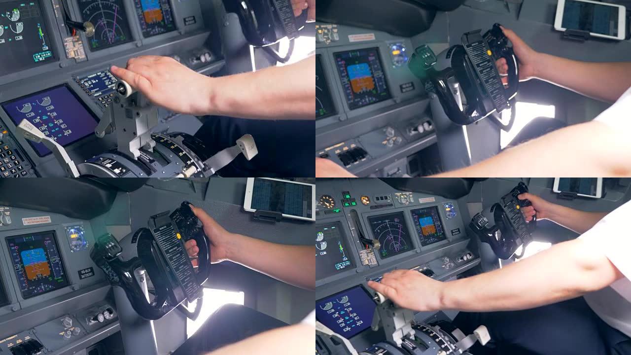 一名飞行员在驾驶舱控制一架飞机，特写镜头。