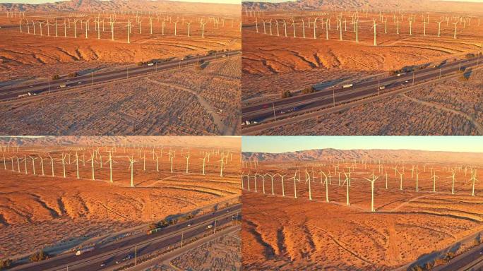 日落时沙漠中风电场和高速公路的鸟瞰图