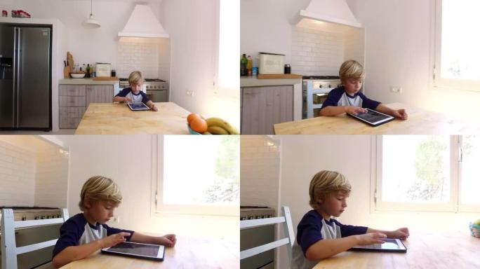 手持式弧线拍摄男孩在厨房用平板电脑