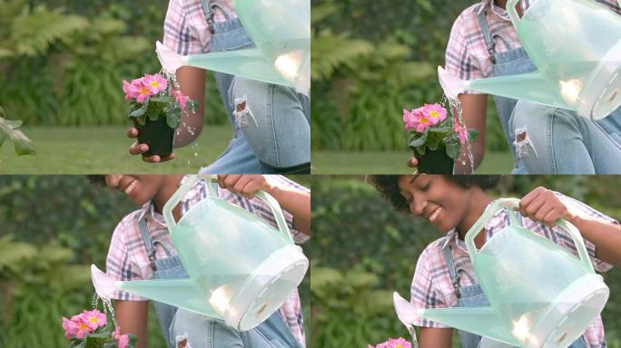 微笑的女人给植物浇水