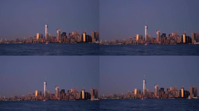 日落时在上湾巡游，俯瞰着曼哈顿下城的标志性天际线