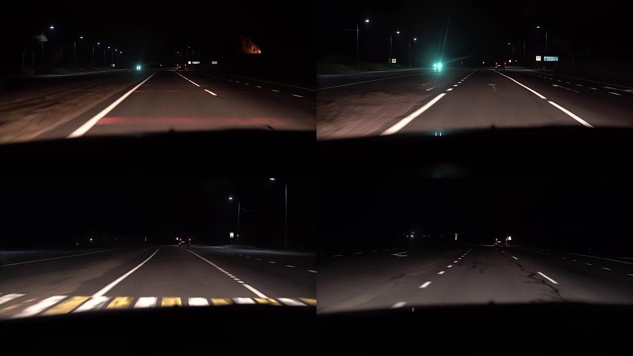 从车内可以看到夜景。前灯和其他汽车在乡村道路上运动