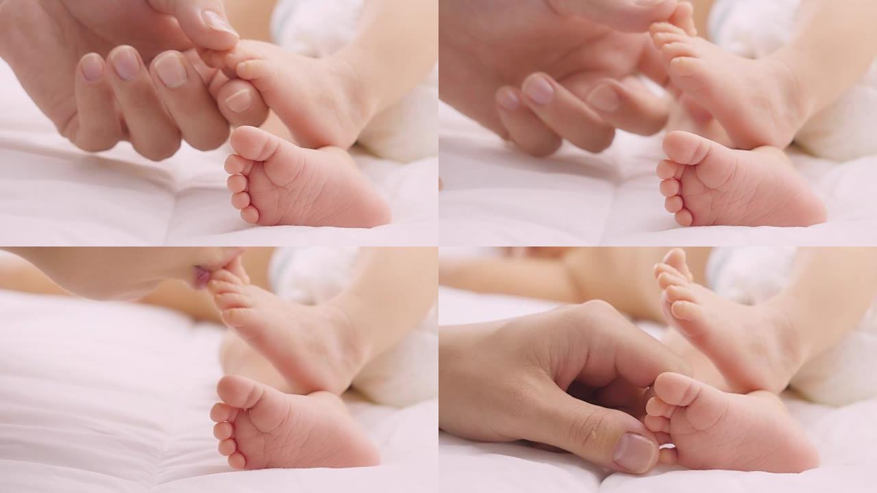 婴儿的脚在母亲的手中。