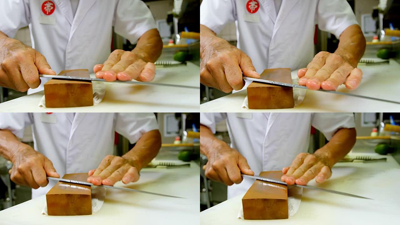 4k厨房磨刀石上的男厨师磨刀刀