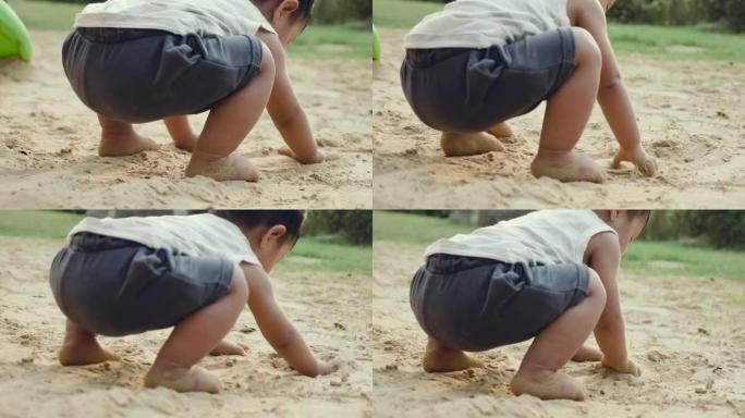 小男孩玩沙子