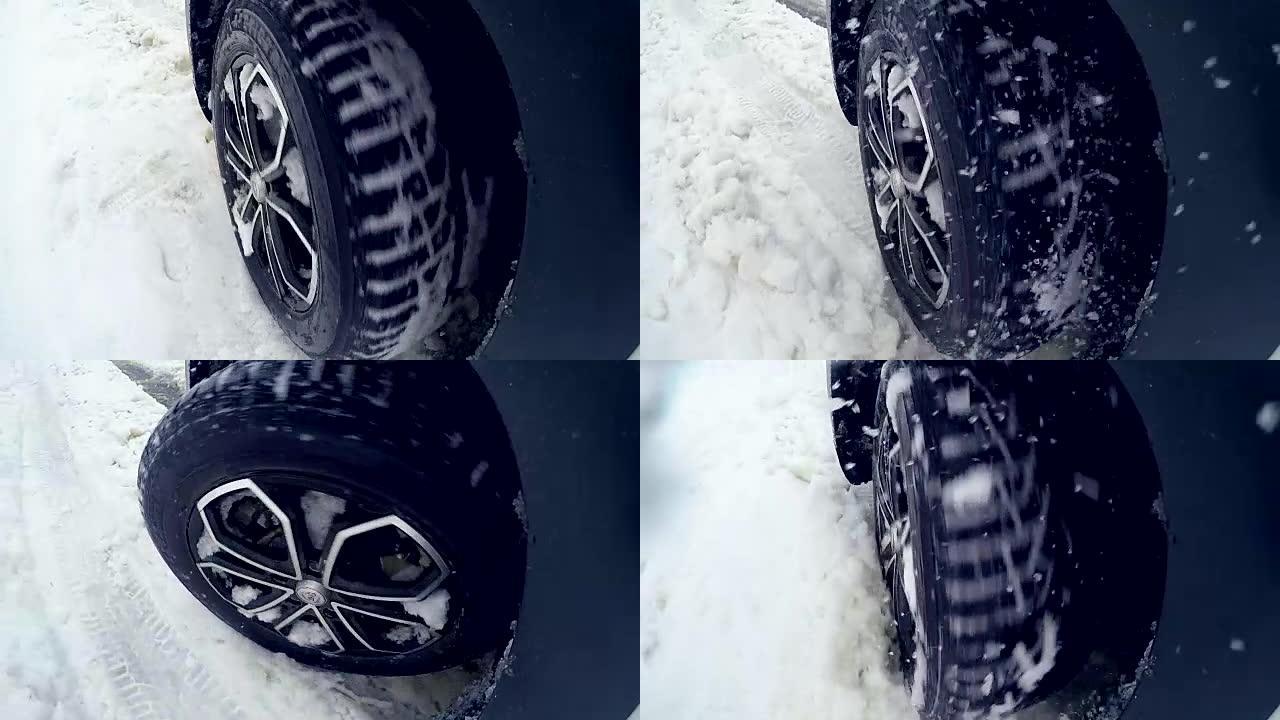 轮胎，在大雪中行驶的车轮。慢动作。在摄像机上。