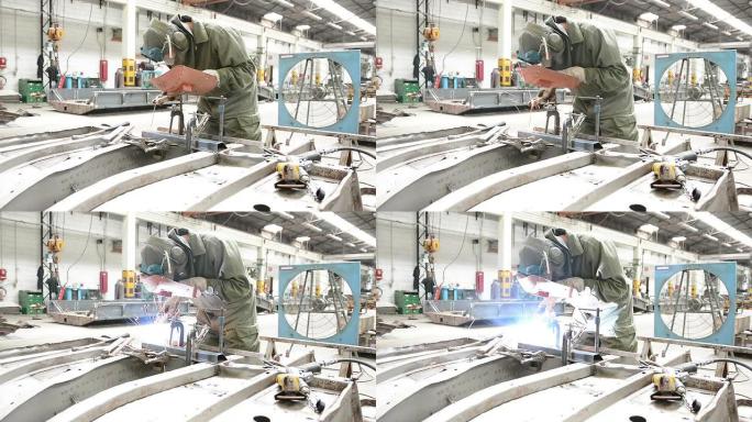 焊接现代化机械设备工厂车间实拍电焊工人
