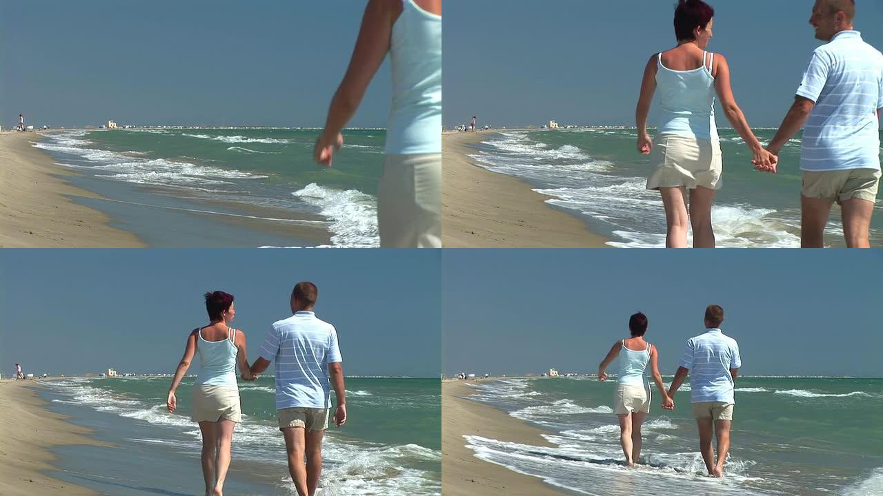高清: 海滩上的浪漫漫步