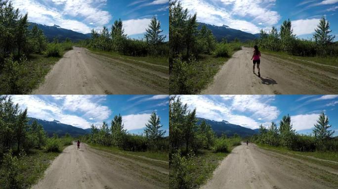 健康女性慢跑通过4k路的后视图