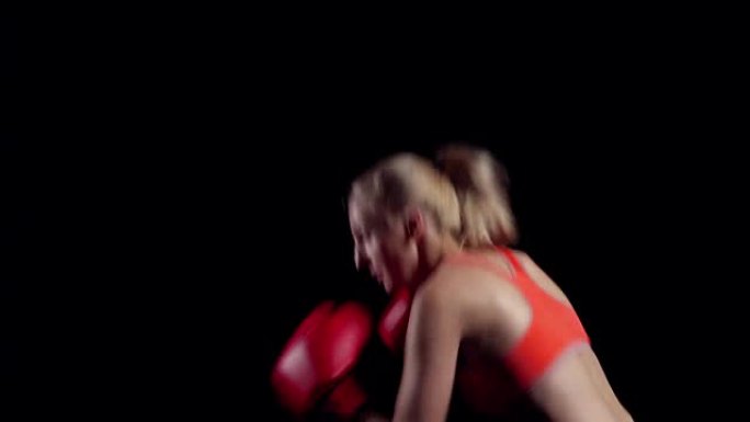 运动训练女拳击手。快速而精确的打击