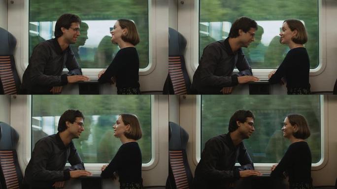 男人和女人在火车上交谈