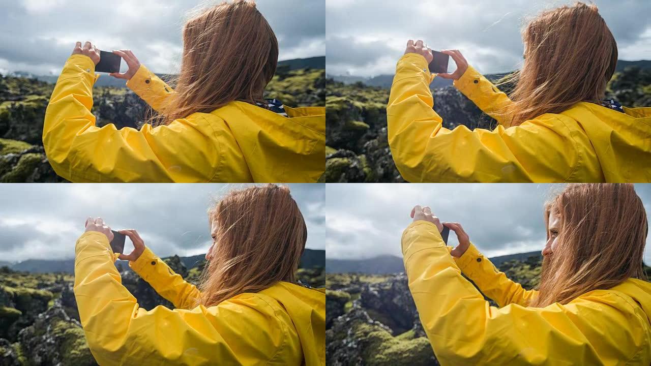欣赏冰岛岩石和苔藓景观的女人