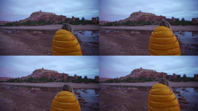 Woman admiring majestic old buildings in Aït Benha