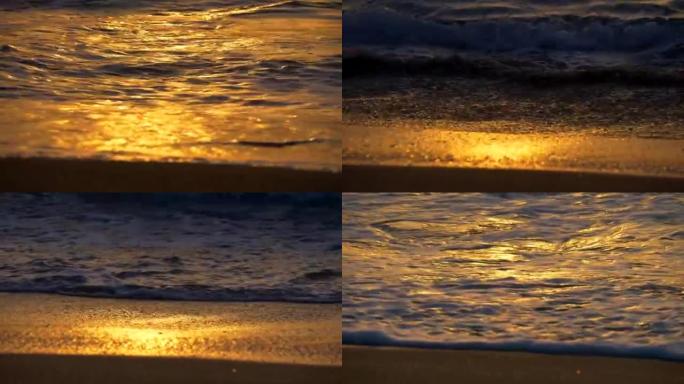 金色的海浪反射日落。日落灯光下的沙滩。4K, UHD