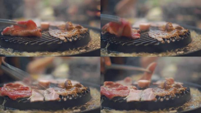 在炉子上烧烤的烧烤。关闭日本餐厅烤牛肉。烧烤或日式食品用生牛肉片
