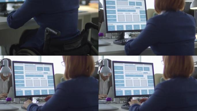 坐在轮椅上的女商人在电脑上工作