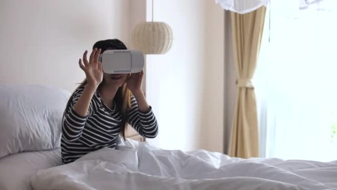 女人在家使用虚拟现实模拟器眼镜