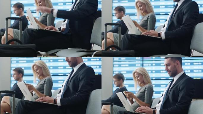 商人在机场候机室等候登机时在笔记本电脑上工作。