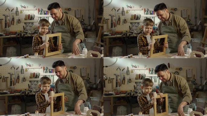 男孩和父亲打磨木制相框