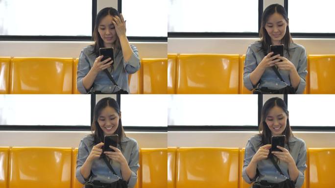 年轻女性游客乘坐地铁旅行，并在地图上看智能手机