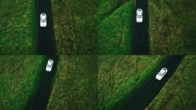 在乡村道路上行驶的鸟瞰图电动汽车