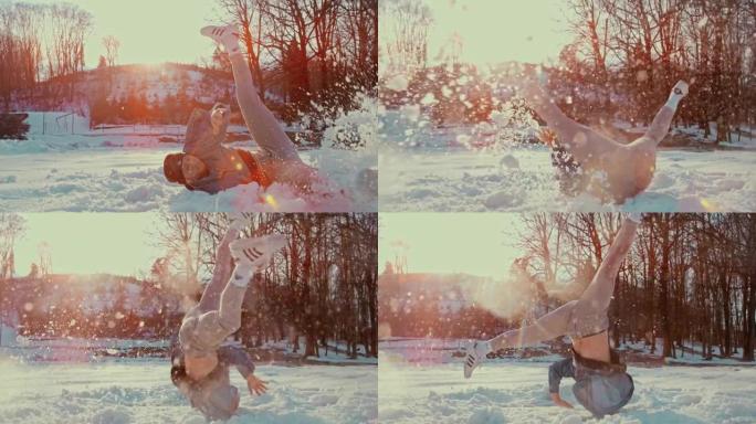 SLO MO B-boy在雪地里表演杂技动作