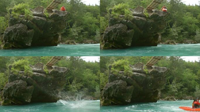 高清: 皮划艇运动员从岩石上跳下来