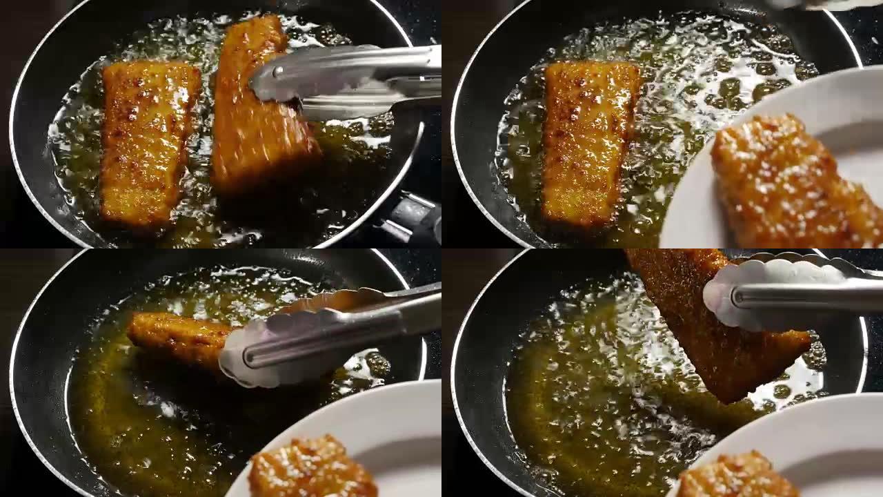 鱼角在煎锅里烹饪。