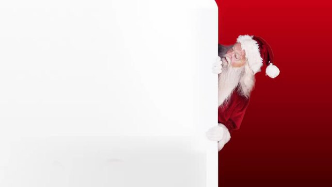 圣诞老人在节日背景上偷看礼品卡