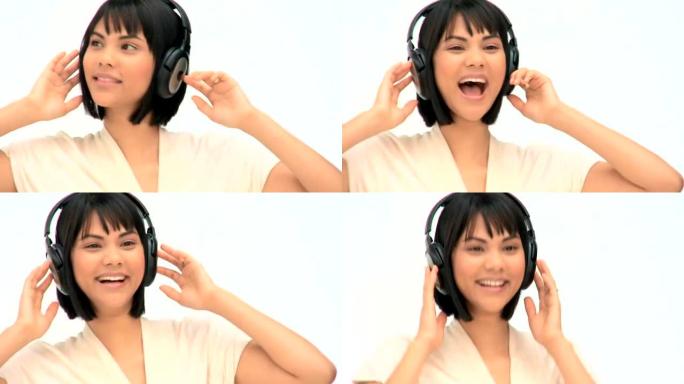 可爱的亚洲女人听音乐
