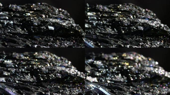 BOKEH闪闪发光的深色矿物，具有金属和脆性表面，称为赤铁矿