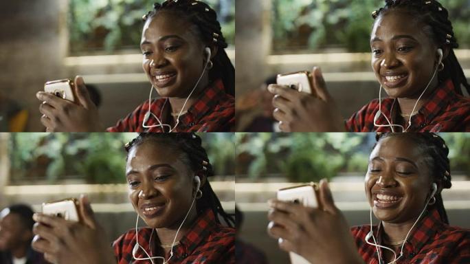 年轻的黑人妇女通过智能手机进行视频通话