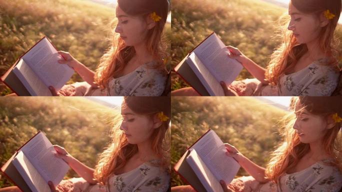 女孩在乡下的草地上看书