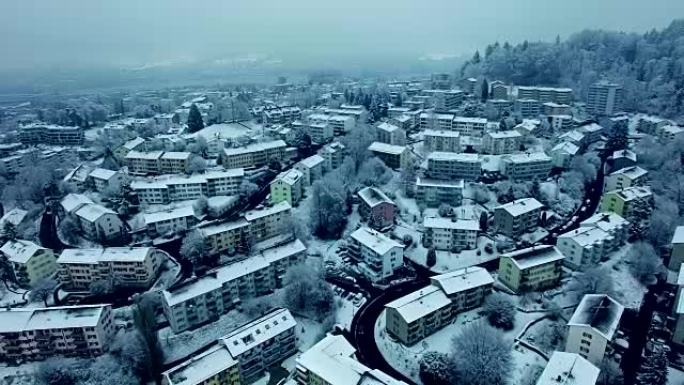 Arial shot of snow covered village in wintertime