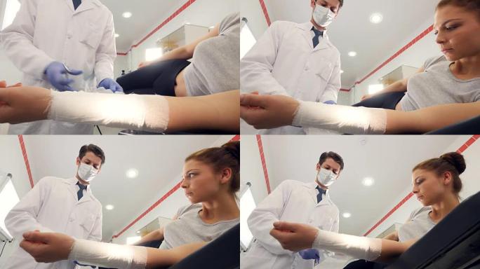 一位专业医生正在用绷带包扎女孩的手臂