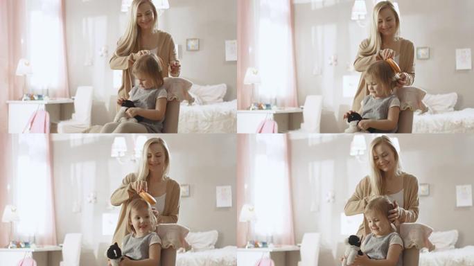 可爱的年轻母亲为她可爱的金发小女儿梳头。慢动作。
