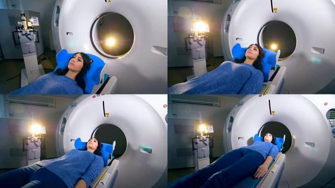 现代医院磁共振成像MRI扫描仪上的年轻女孩。
