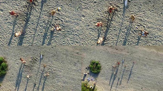 空中无人机拍摄的人在海边打沙滩排球。