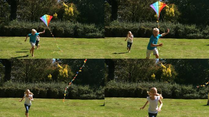 小女孩在追哥哥玩风筝