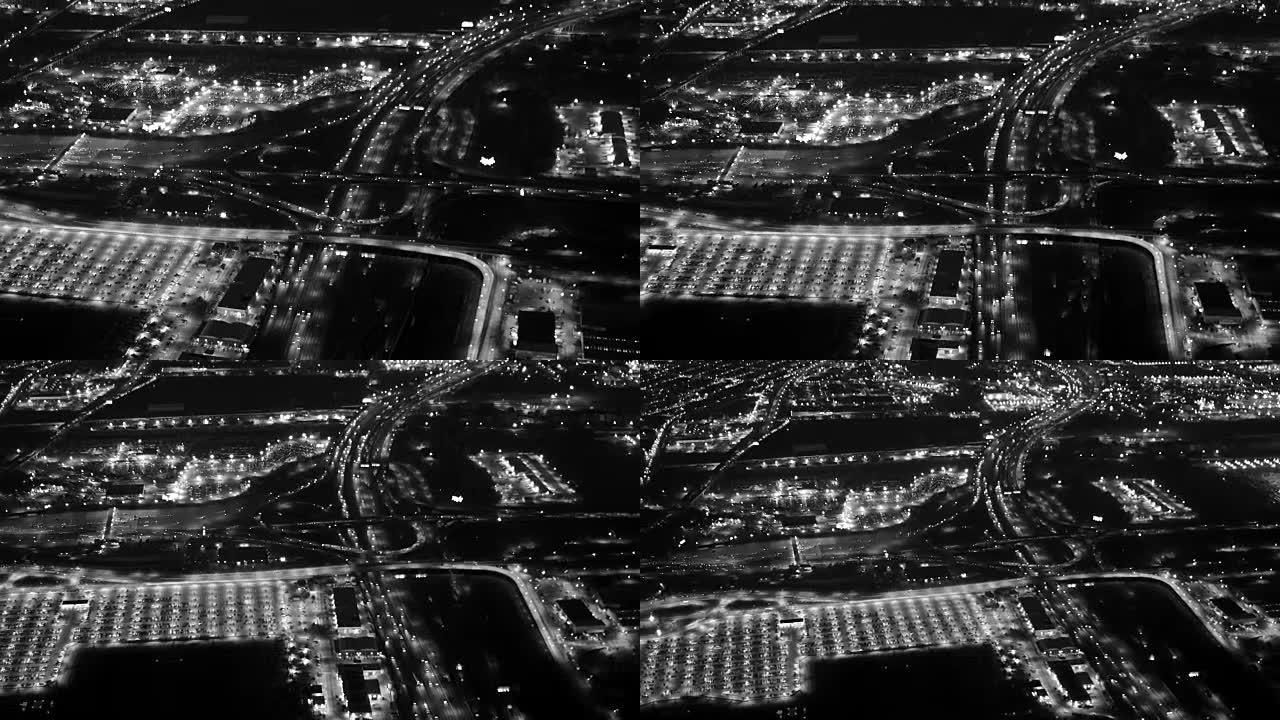 夜间现代高速公路的鸟瞰图。照亮了多个车道。
