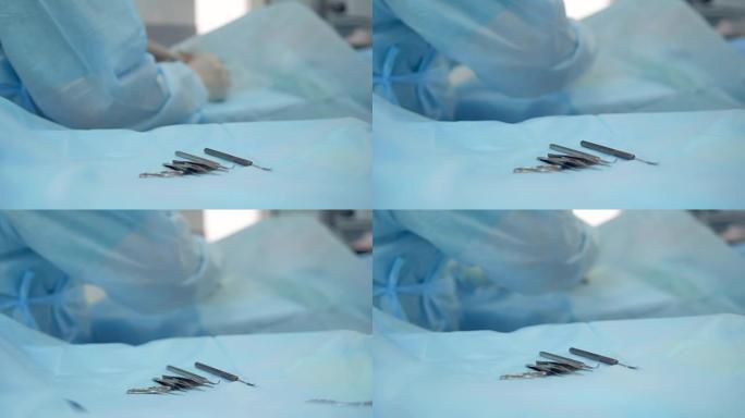 手术工具集中在一张床单上，背景是一名外科医生。4K。