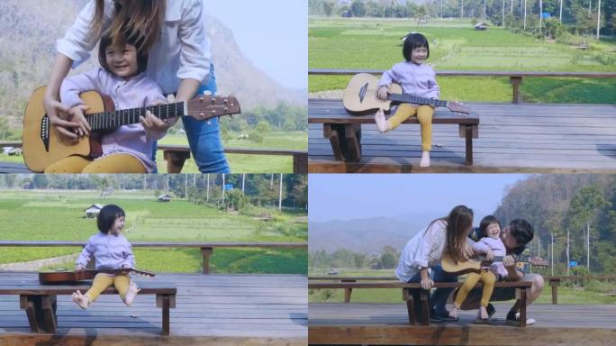 玩有趣吉他的快乐小女孩