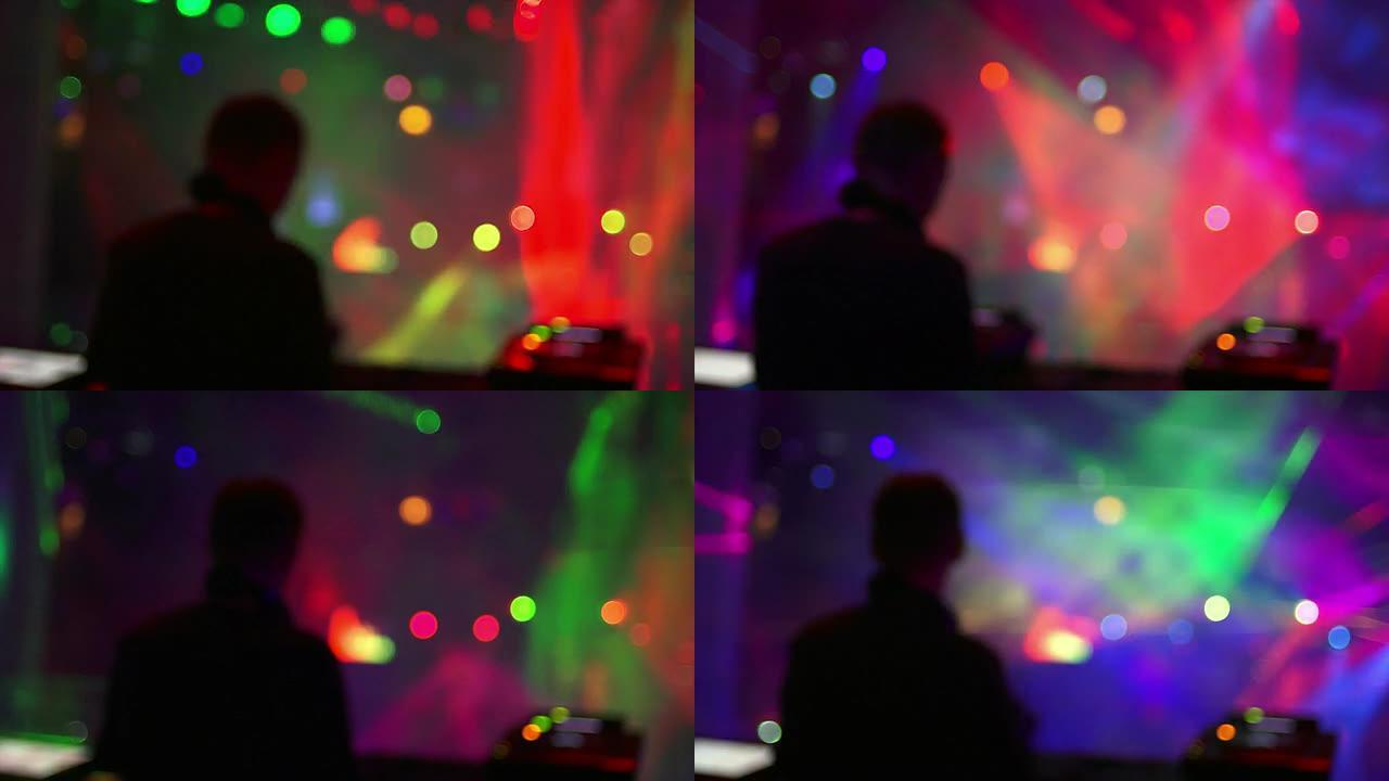 迪斯科舞厅灯光前的高清DJ展位（散焦）