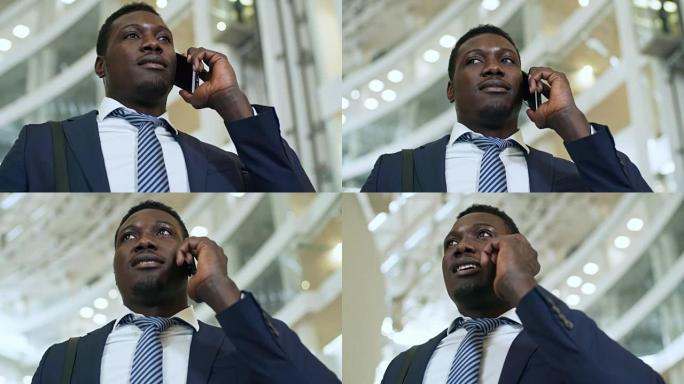 非洲男子在商务中心进行电话交谈