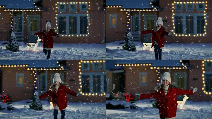 可爱的小女孩在飘落的雪中张开双臂奔跑。一个冬天的夜晚，孩子们在装饰有花环和圣诞树的房子的背景下玩得开