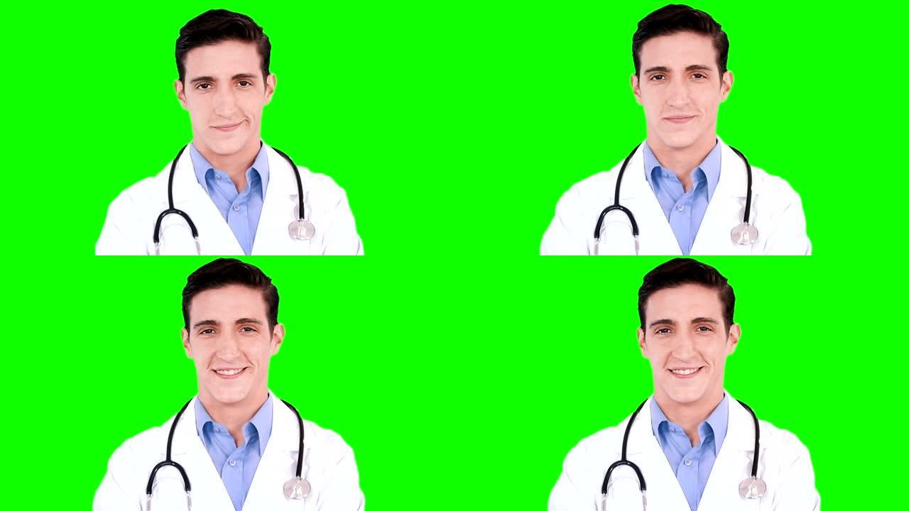 年轻的医生微笑着。绿屏。医护人员。